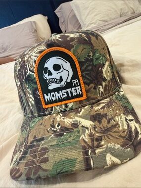 Camouflage “Momster” Skull Patch Trucker Hat - Camo/Orange